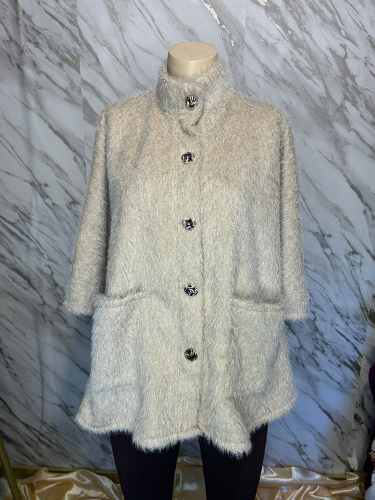 Fluffy poncho crème